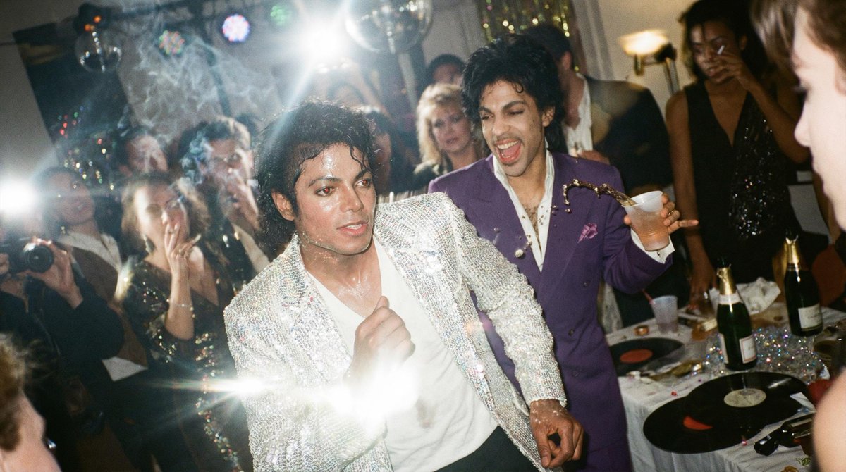 A chaotic, poorly composed 1990s flash photo taken with a disposable film cam...